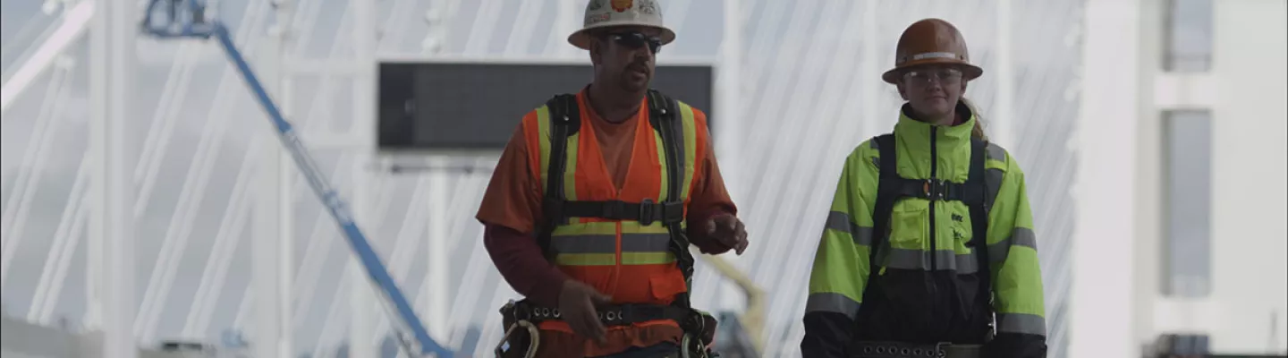 two men in hard hats on construction site