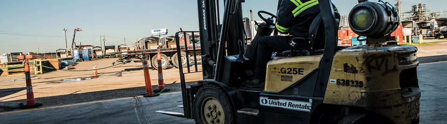 Worker on forklift