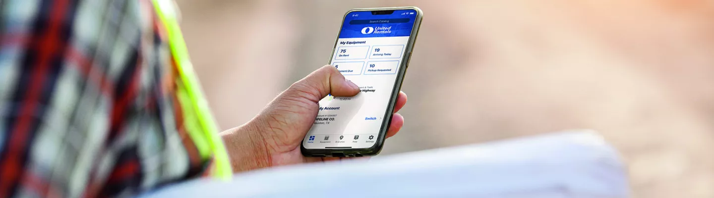 Construction worker using United Rental mobile app