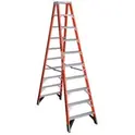 Red step ladder open and on the ground
