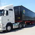 Intermodal Freight Container on truck with black side curtain