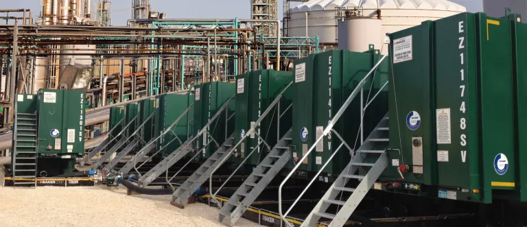 green tanks at refinery