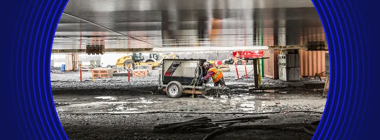 Worker in muddy jobsite