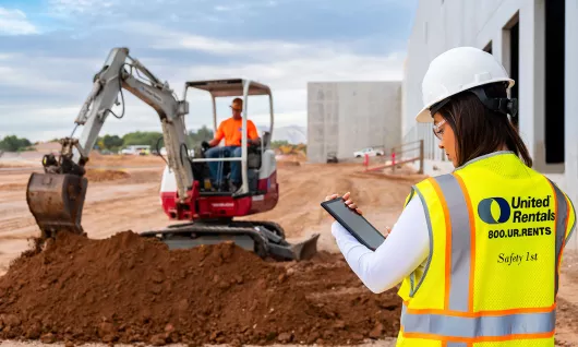 Workers onsite excavating dirt