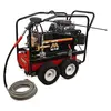 Black and red Mi-T-M 5,000 psi pressure washer being used to wash a piece of heavy machinery