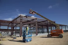 Worker inside lift at jobsite
