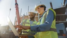 Two workers at jobsite