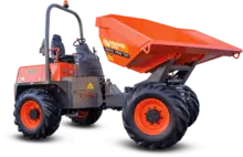 Site dumper positioned on a construction site, used for transporting materials with safety barriers in the background.